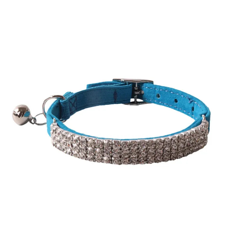 Elastic buckle cat collar in assorted colours with breakaway clasp, showing flocked material texture