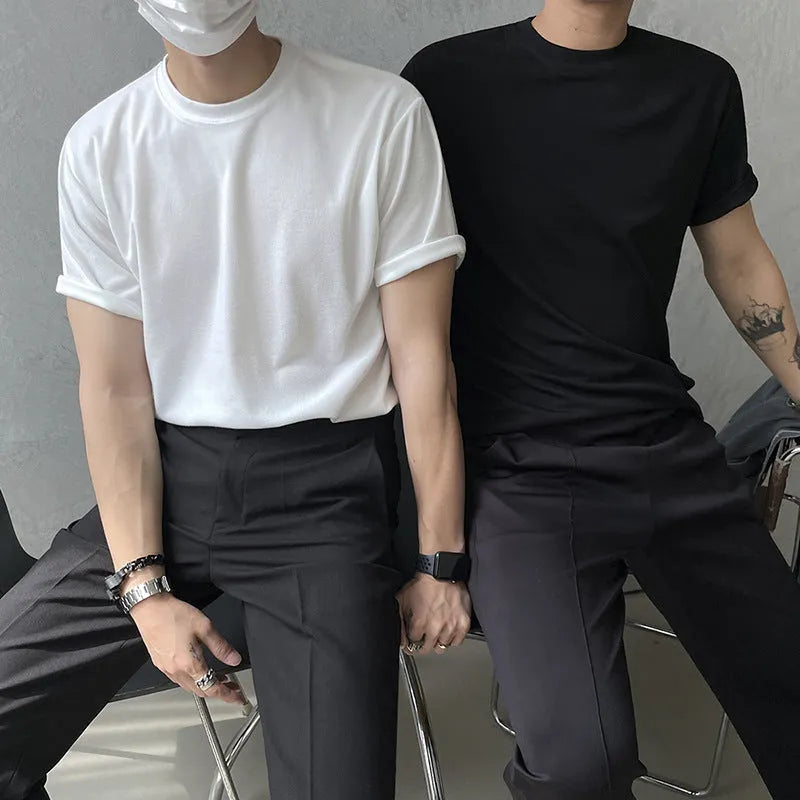 A man's slim-fit cotton T-shirt in solid white, showing the regular half-length sleeves and round neck.
