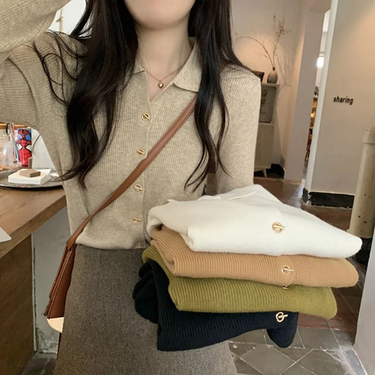 Loose fit beige viscose knitted cardigan with long sleeves, shown worn open.