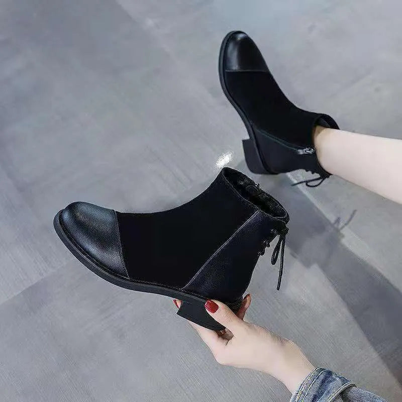 Black women's over-the-knee Martin boots with side zipper and decorative bow.