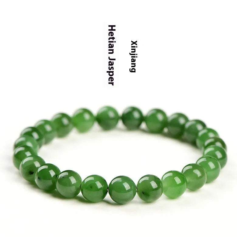 Polished Hetian jade jasper ball bracelet showing natural stone beads in multiple size options on a wrist.
