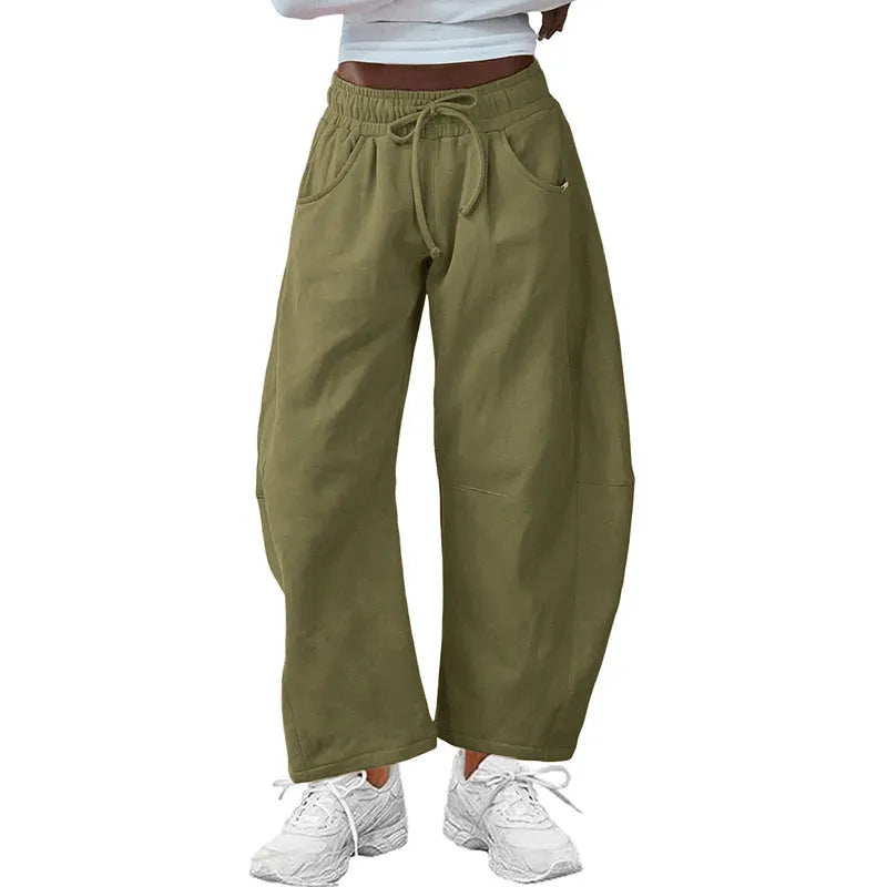 Loose cropped cotton sweatpants with elastic drawstring waist and side pockets in multiple colour options