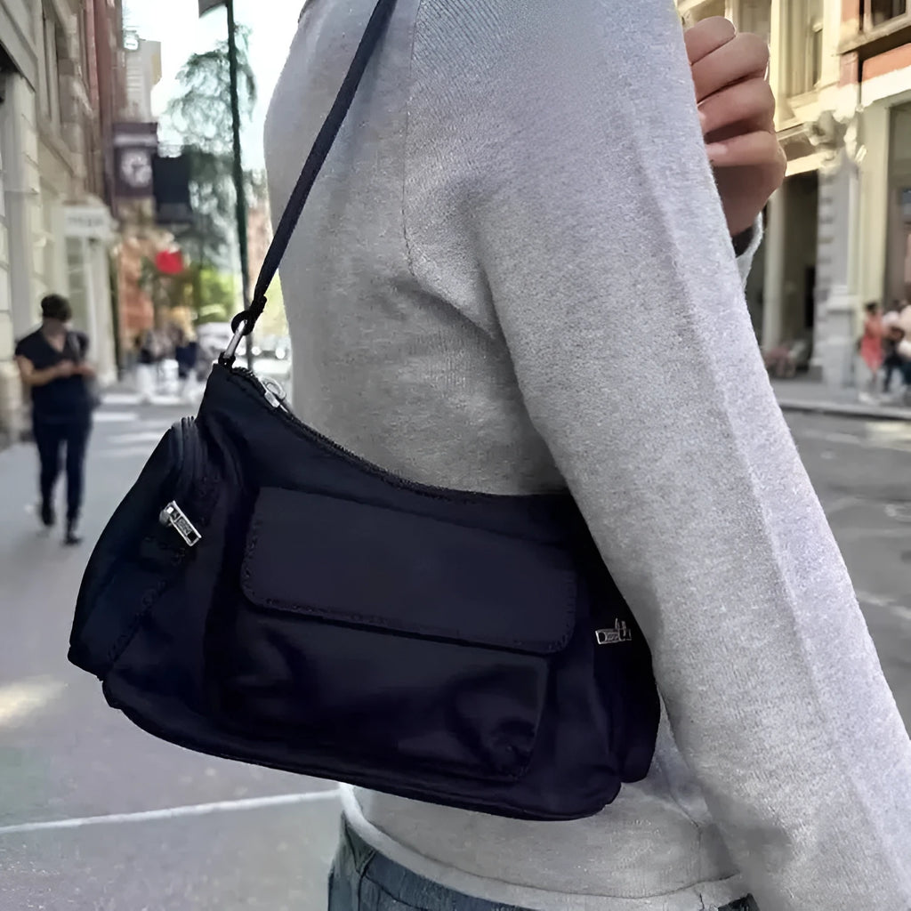 Black PU lightweight shoulder bag with two pockets and side line detail