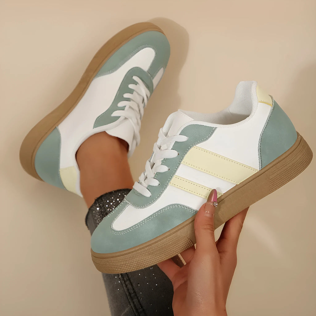 Women's green retro sports shoes with cross straps and leather stitching, low-top design with rubber sole