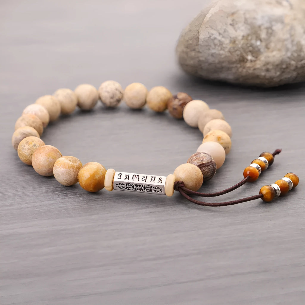 Handmade stone bead bracelet in wood colour on a simple background, showing retro style design.