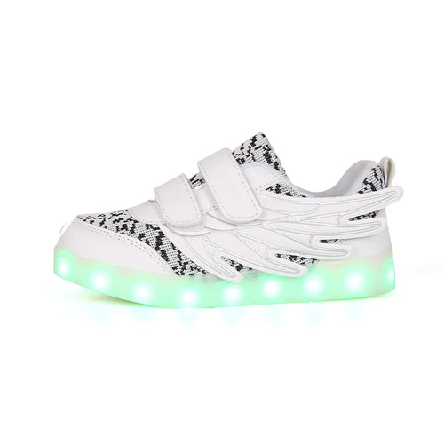 Children's plum red sneakers with multicolour LED lights glowing on the soles.