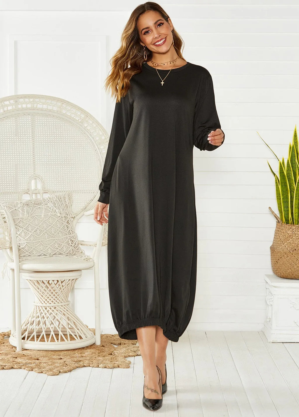 Black lantern dress with lace-up crew neck and loose silhouette, shown front view