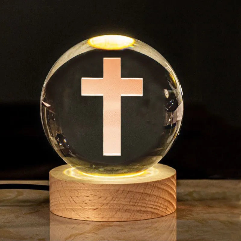 White crystal lamp with 6cm diameter orb on solid wood warm light base showing religious ornamentation