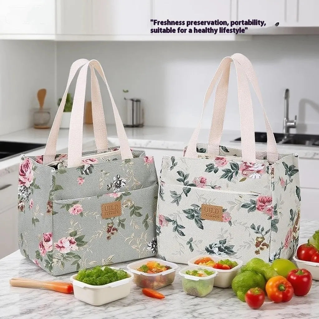 Women's printed canvas handbag with aluminium frame in square horizontal design showing floral pattern