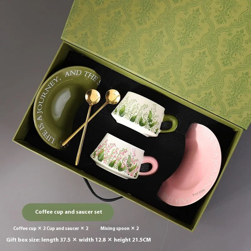 Ceramic coffee cup and saucer set with two cups, two plates, and two spoons in 300ml capacity