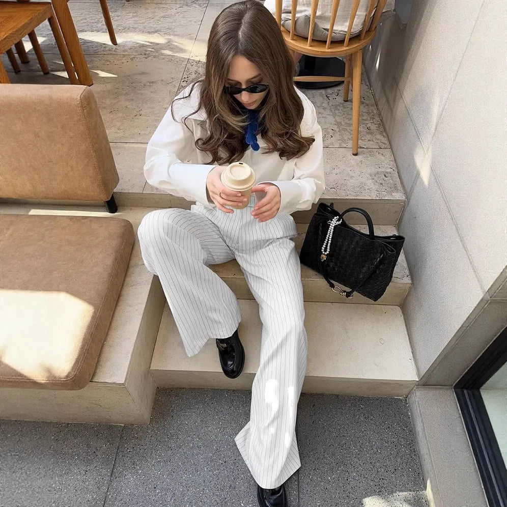 White striped wide-leg women's trousers with front zipper in loose casual fit