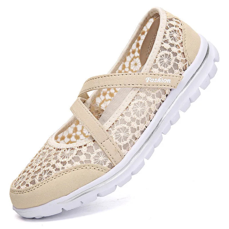 Women's flat casual shoes in beige with mesh upper and round toe, shown from the side.