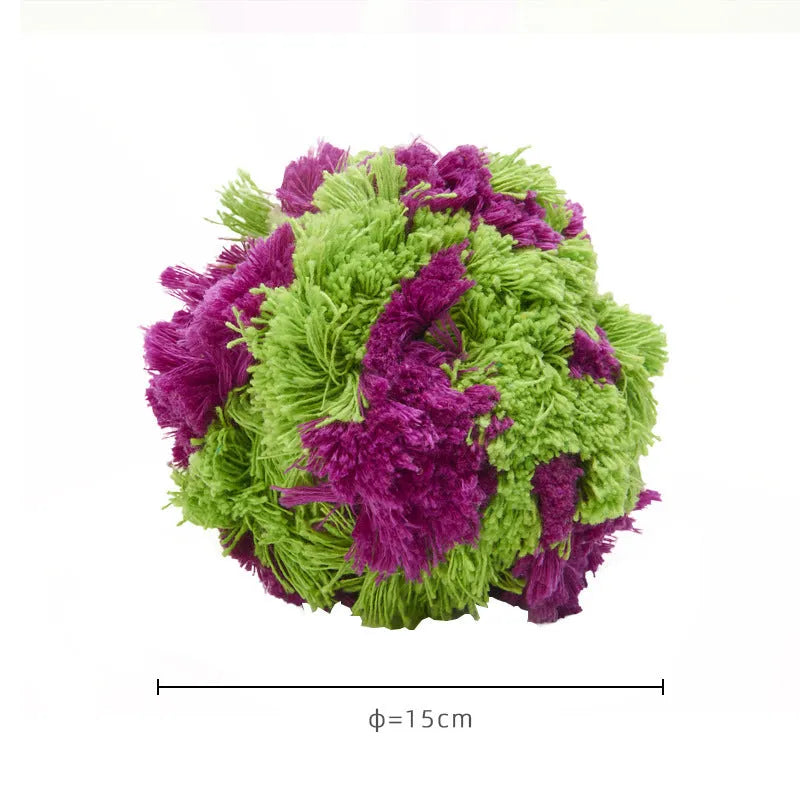 Purple plush dog chew ball with knotted seaweed design measuring 15cm diameter