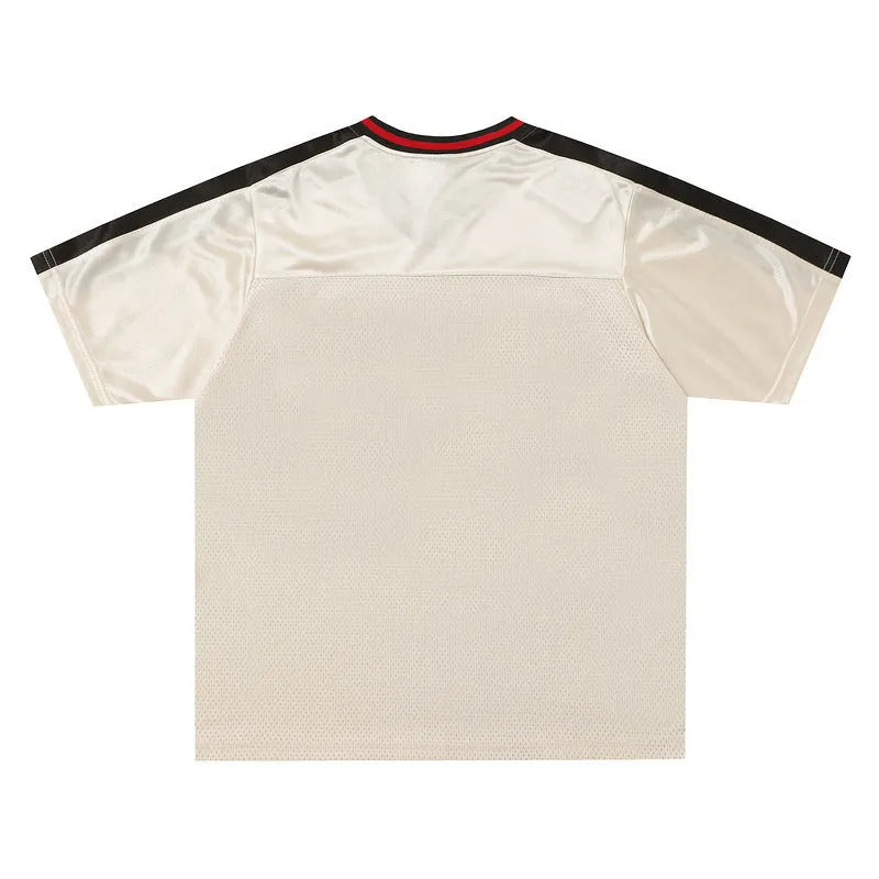 Apricot coloured men's V-neck loose fit pullover jersey with letter pattern and drop shoulder sleeves.