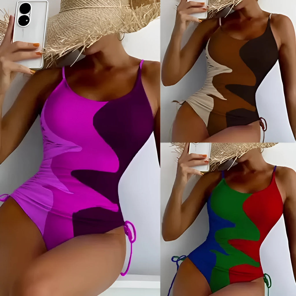 Women's sleeveless backless one-piece swimsuit in a striped pattern, shown in blue.