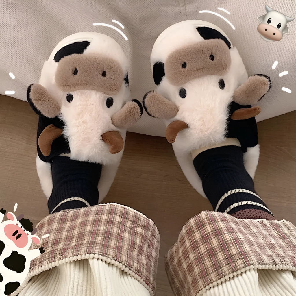 White cow design slippers with plush faux fur upper and textured non-slip sole