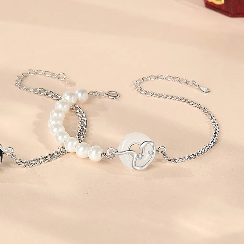 925 sterling silver couple bracelet with snake design and obsidian pearl accents on security buckle