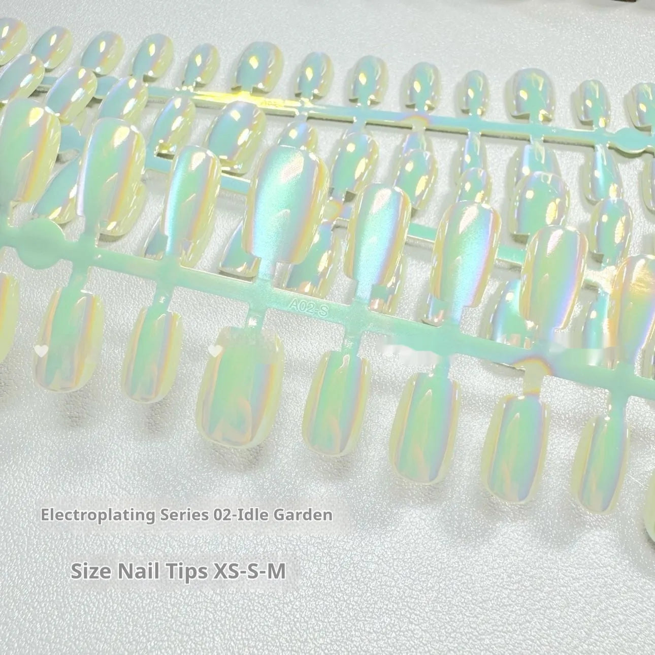 Electroplated Cat's Eye press-on nails with Aurora armour finish in short ladder XS, S, and M sizes