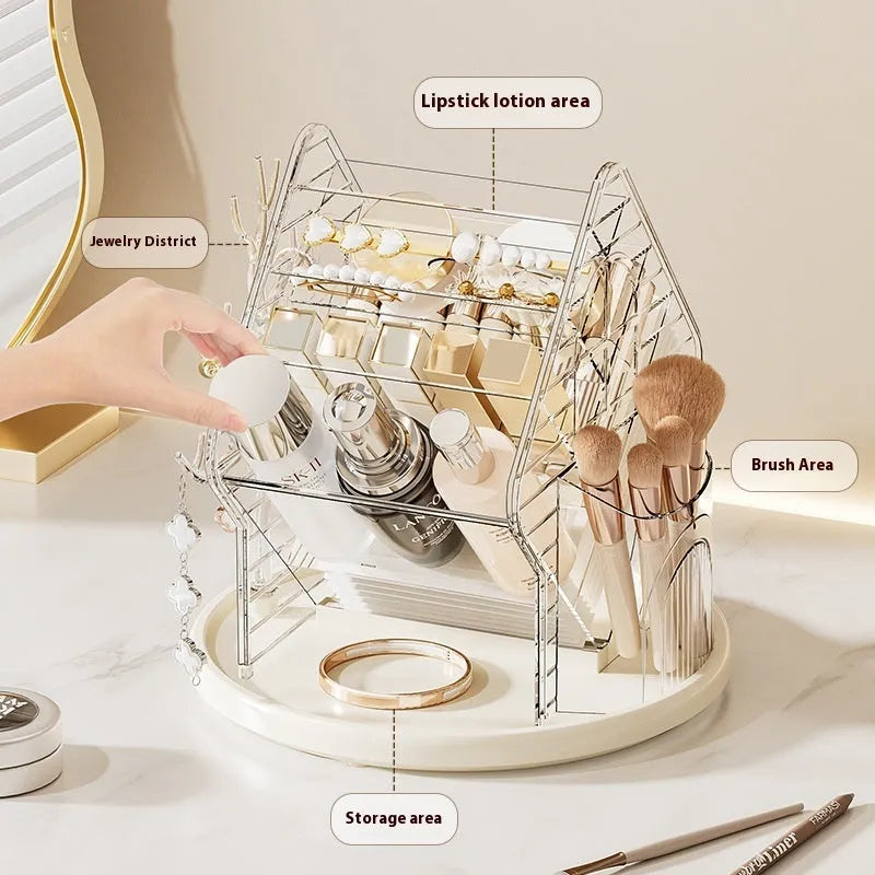 Clear and amber gold rotating cosmetics storage box organiser on a table.