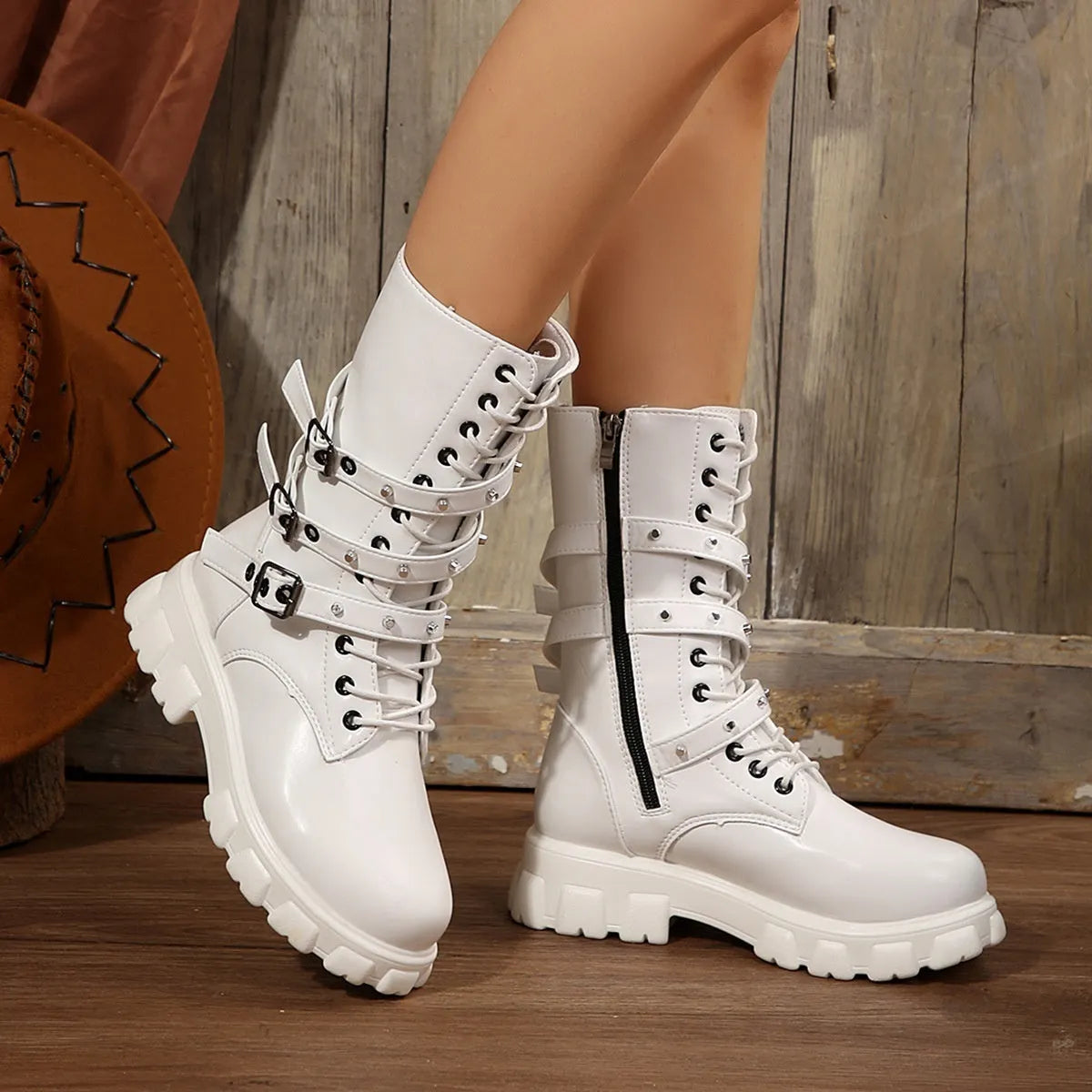 Black mid-calf women's knight boots with metal buckle and side zipper on a white background.