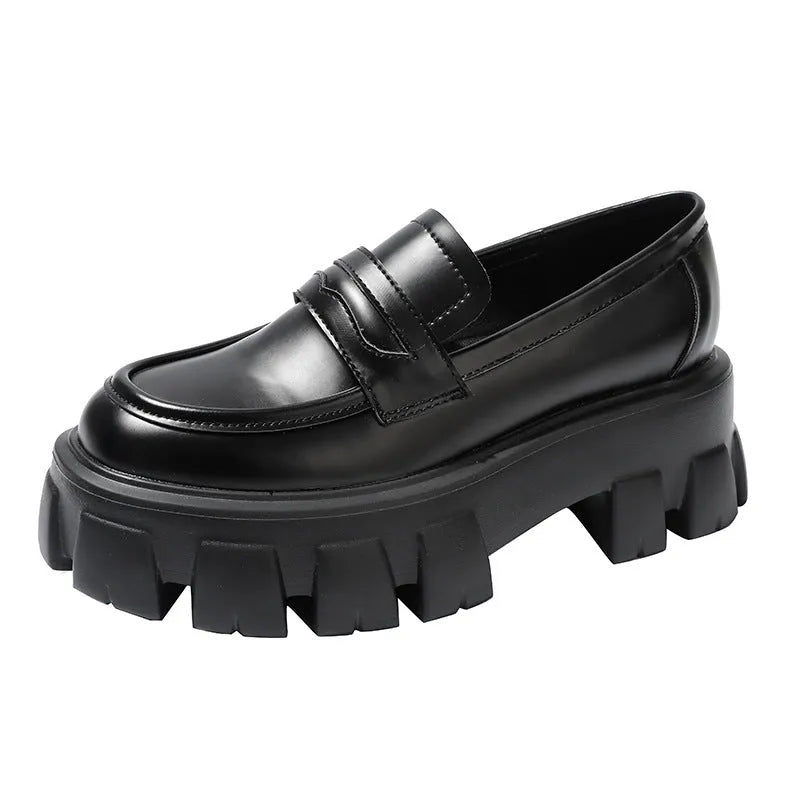 British style wide fit loafers in patent or matte leather with a rubber sole.