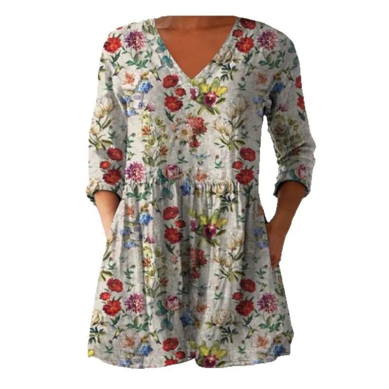 Women's printed wave pattern loose dress with wide waist and three-quarter length sleeves on a hanger.