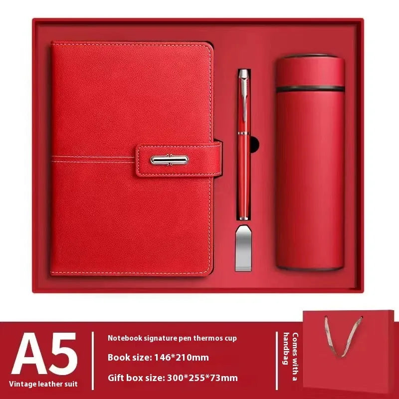 Custom A5 notebook with PU leather cover in selected colour, lying open on wood-free paper pages.