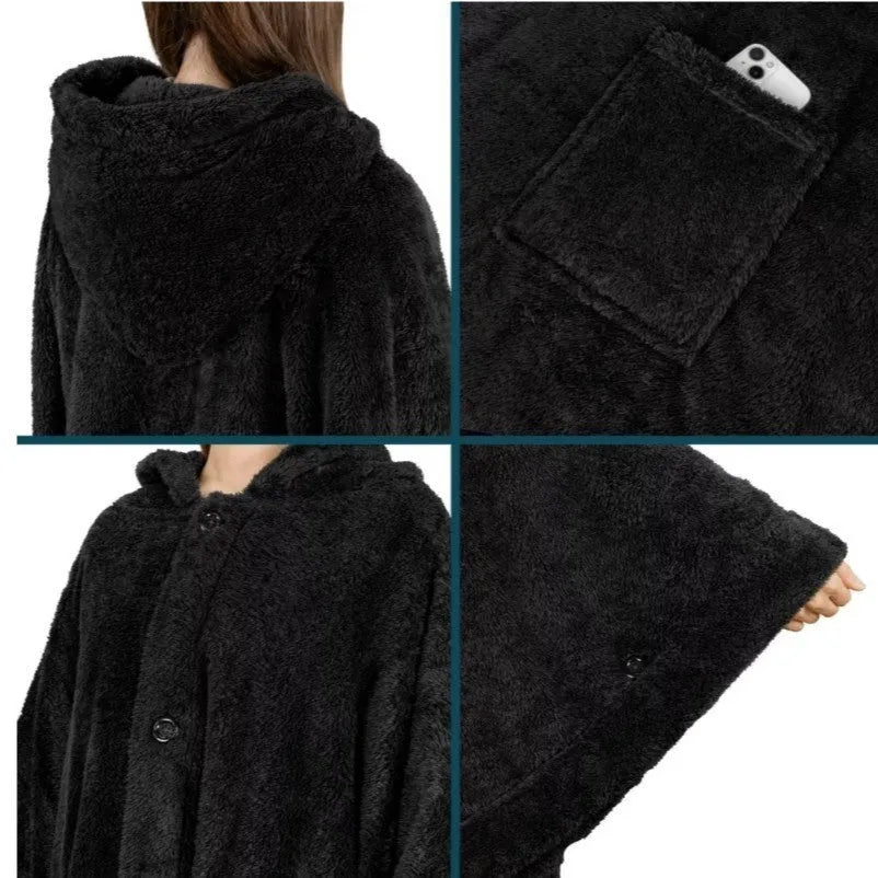 Thick hooded long sleeve bathrobe in black hanging on a hook