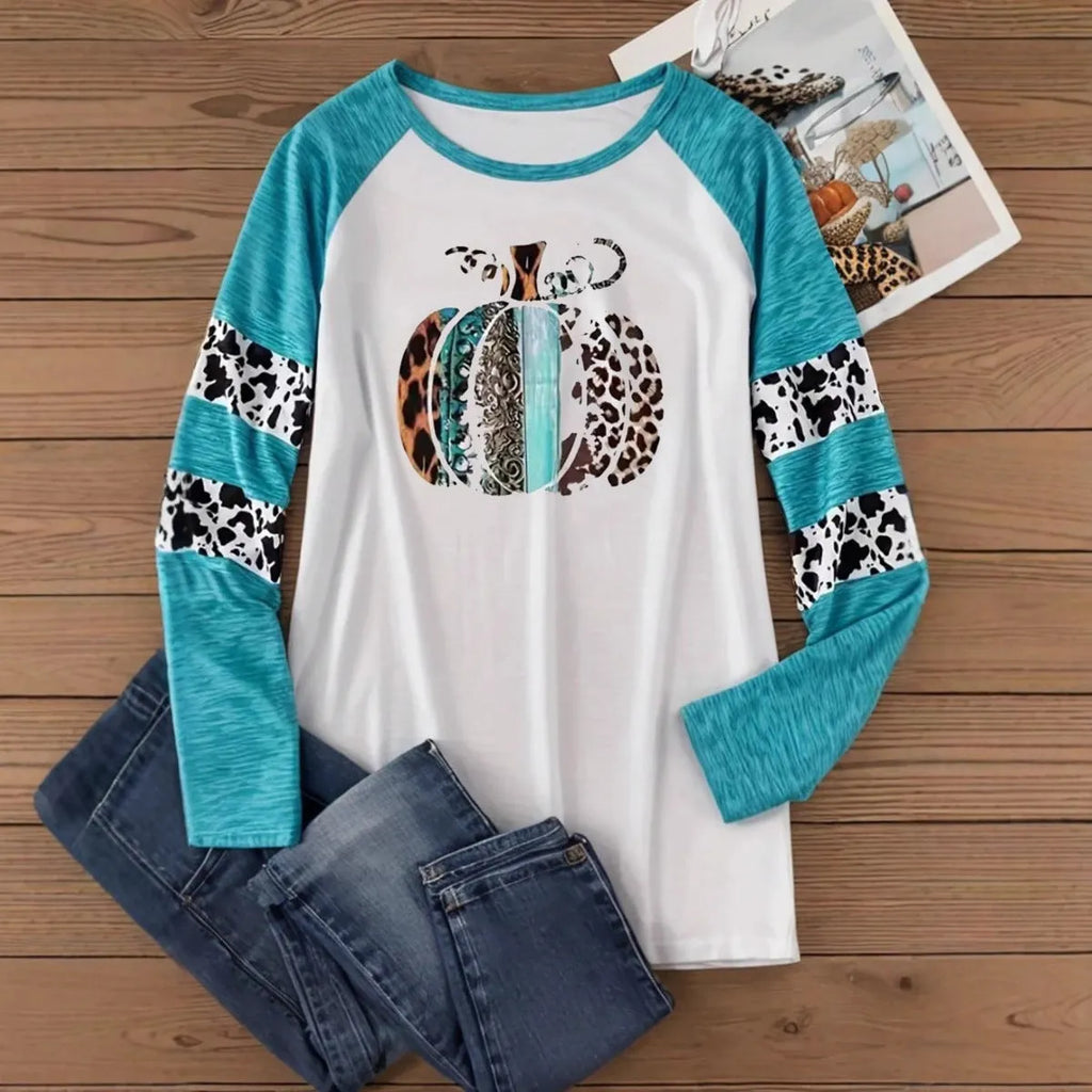 Sky blue Halloween t-shirt featuring a large white 3D digitally printed pumpkin design on the front.