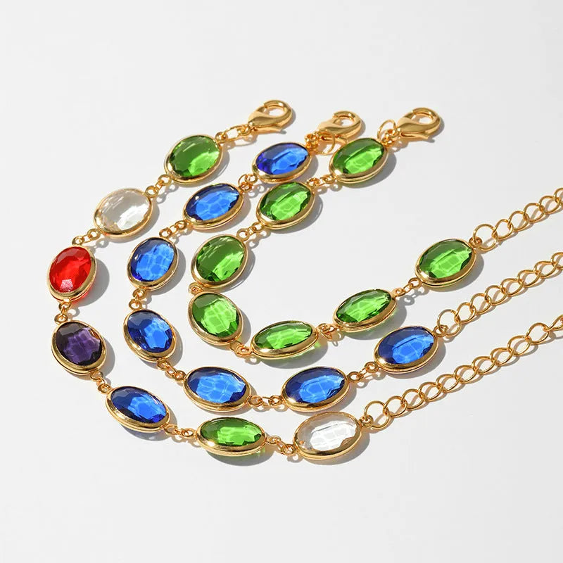 Women's 18K copper geometric ellipse bracelet with blue green multicolor glass inlay detailing