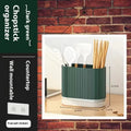 Plastic wall-mounted chopstick and spoon basket in cross-bar design on kitchen wall