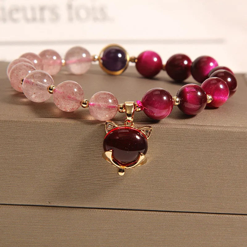 Strawberry crystal elastic bracelet for women on a white background.