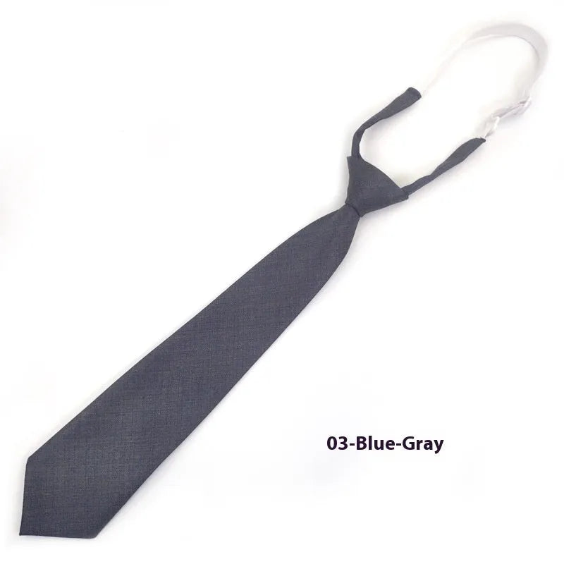 Men's navy blue cotton bow tie with arrow-style design on a white background.