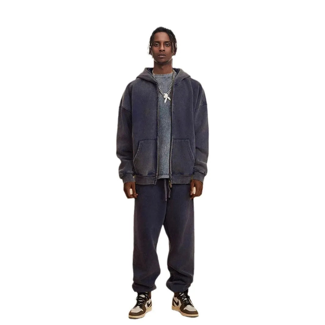 Man's dark green fleece-lined hooded cardigan sweater with a double zip front.