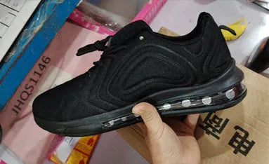 Men's black lace-up running sneakers with a thick sole and round toe design on a white background.