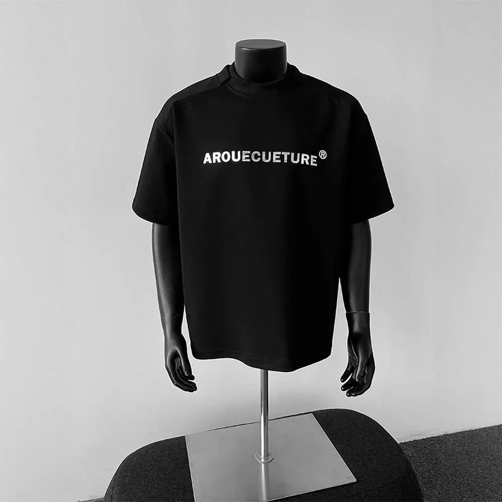 Men's white short sleeve cotton t-shirt with printed letters showing loose fit pullover style