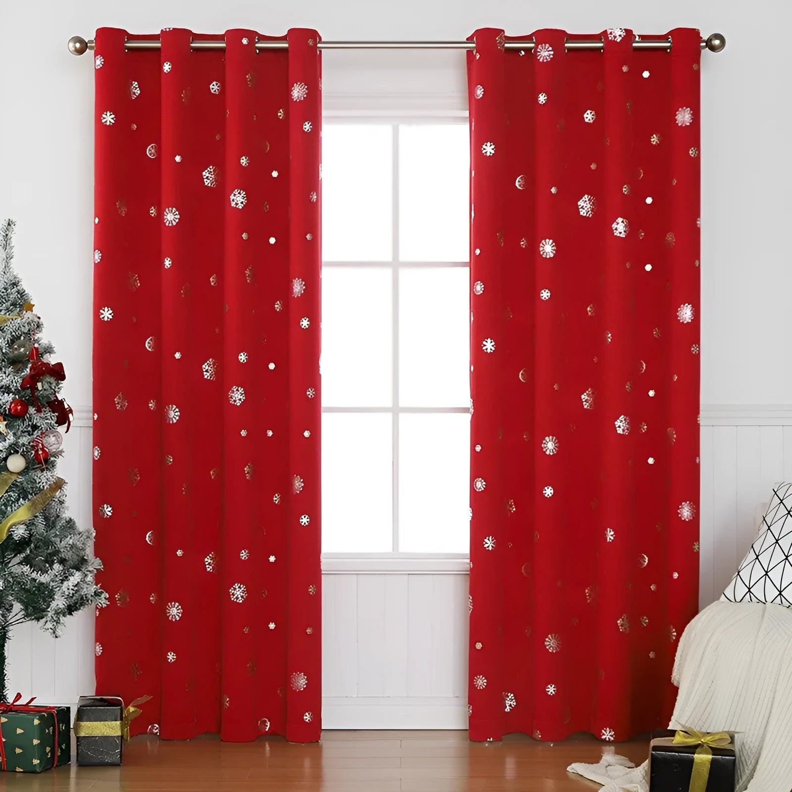 Red polyester snowflake pattern shade cloth curtain with lace loop trim hanging on a window