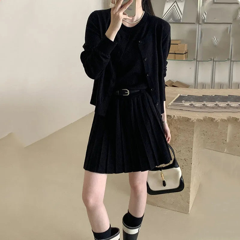 Women's grey vest skirt and cardigan two-piece set with belt and pleated details