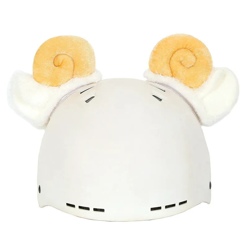 Plush fabric ski helmet decoration with cartoon design on a black ski helmet.