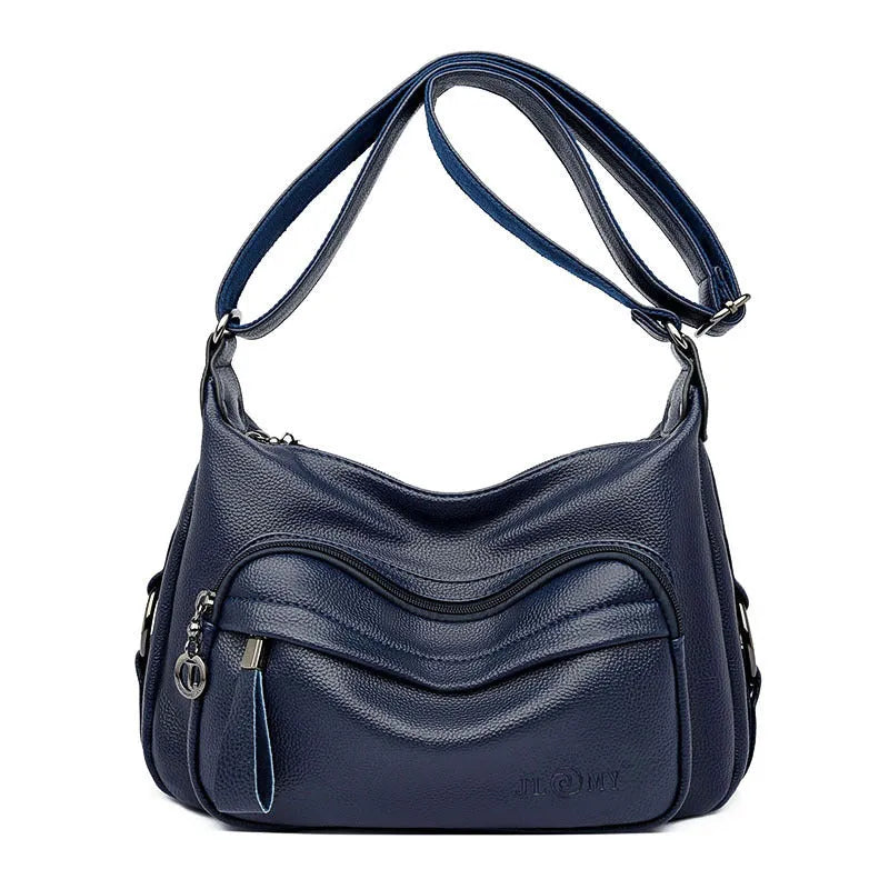 Blue women's large crossbody shoulder bag with multiple internal compartments and soft horizontal square design