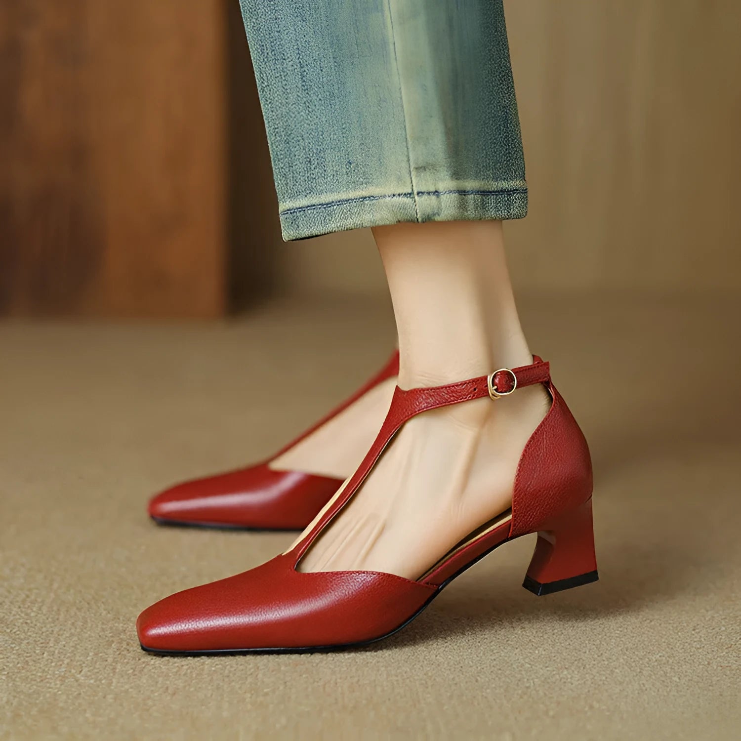Wine red sheepskin leather shoes with square toe and chunky heel, showing buckle fastening