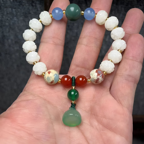 Carved pumpkin lotus bodhi root bracelet with white jade segments and golden silk jade treasures
