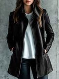 Black women's polyester leather jacket on a hanger, showing long sleeves and medium length.