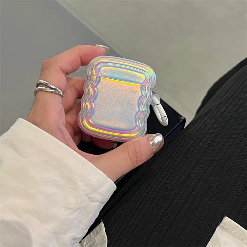 Silicone case for AirPods with a holographic magic laser ring design on a white background.