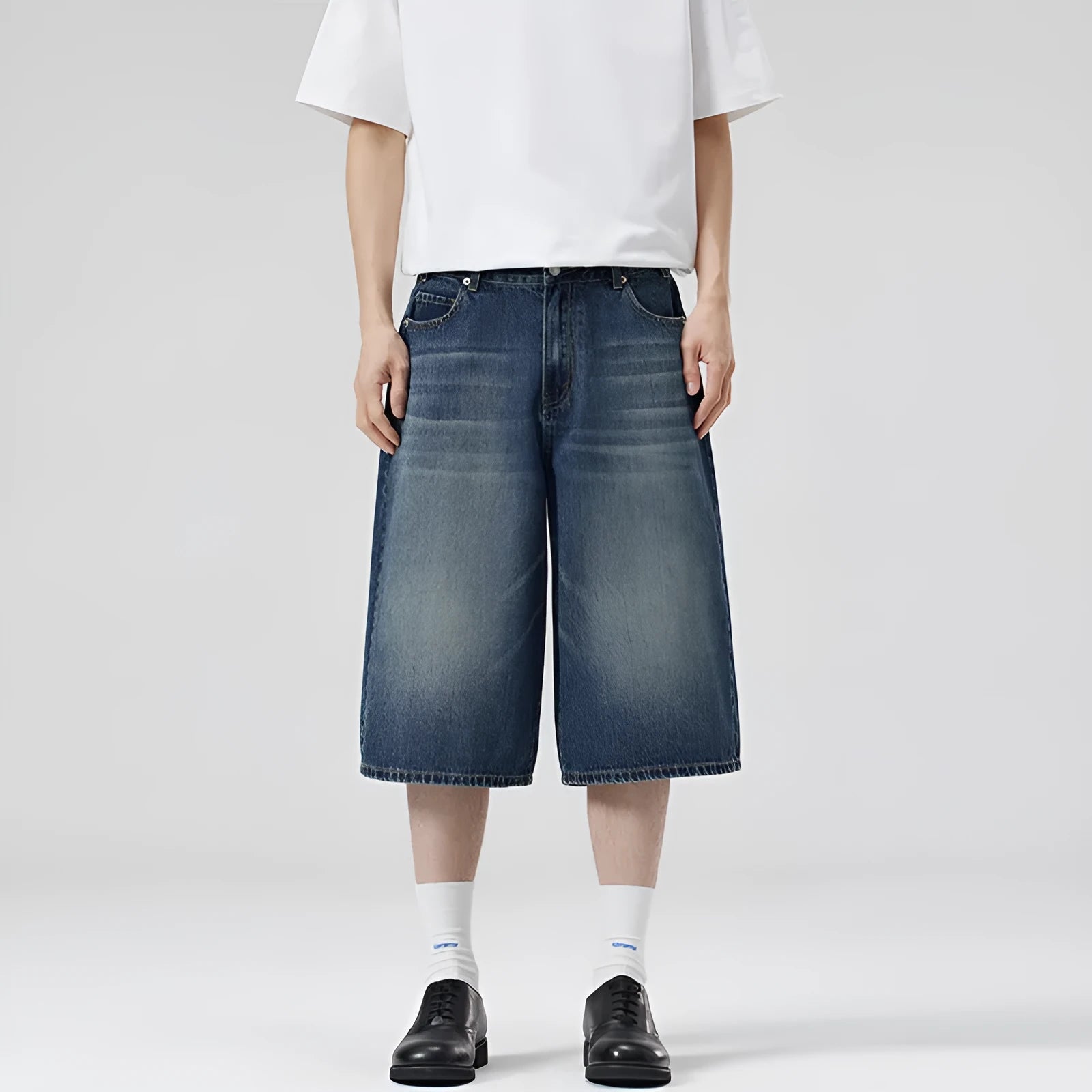 Men's light blue denim shorts with a straight leg and cropped length on a mannequin.