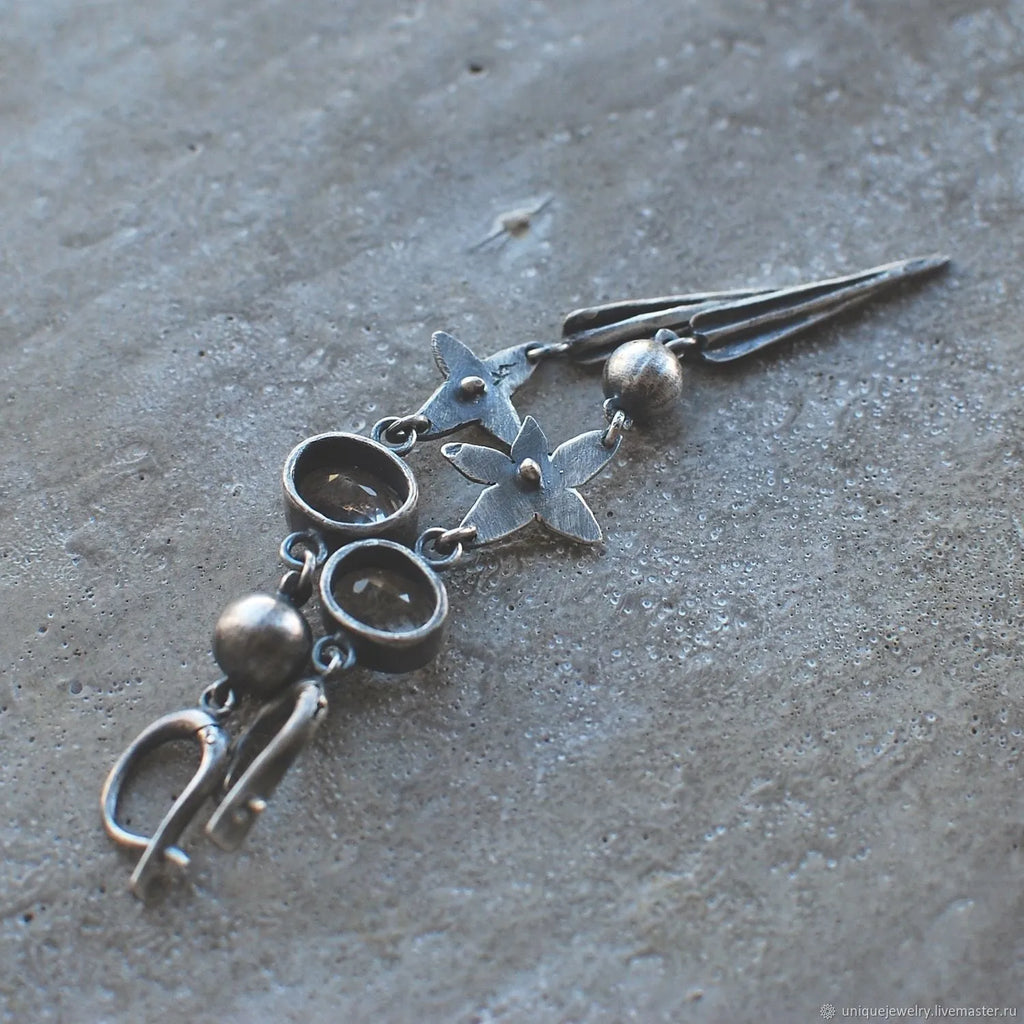 Geometric antique silver pendant earrings with XINGX design and rhinestone detailing