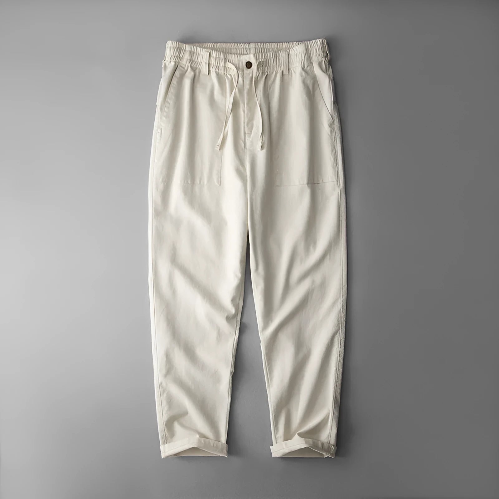 Men's casual linen trousers in a solid colour, shown in a mid-waist, full-length trouser style.