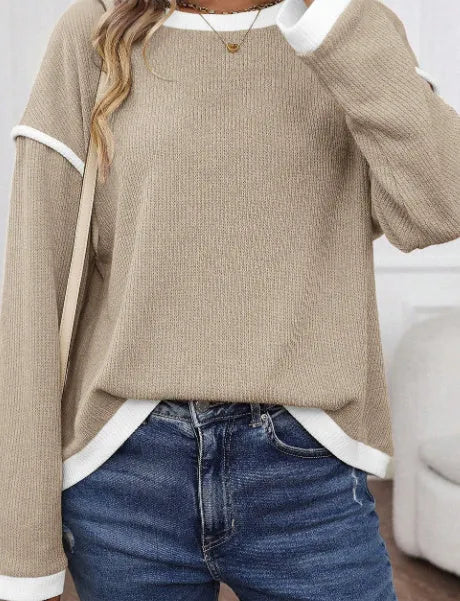 Loose drop shoulder knit top with four leaf clover contrast trim at collar and sleeves