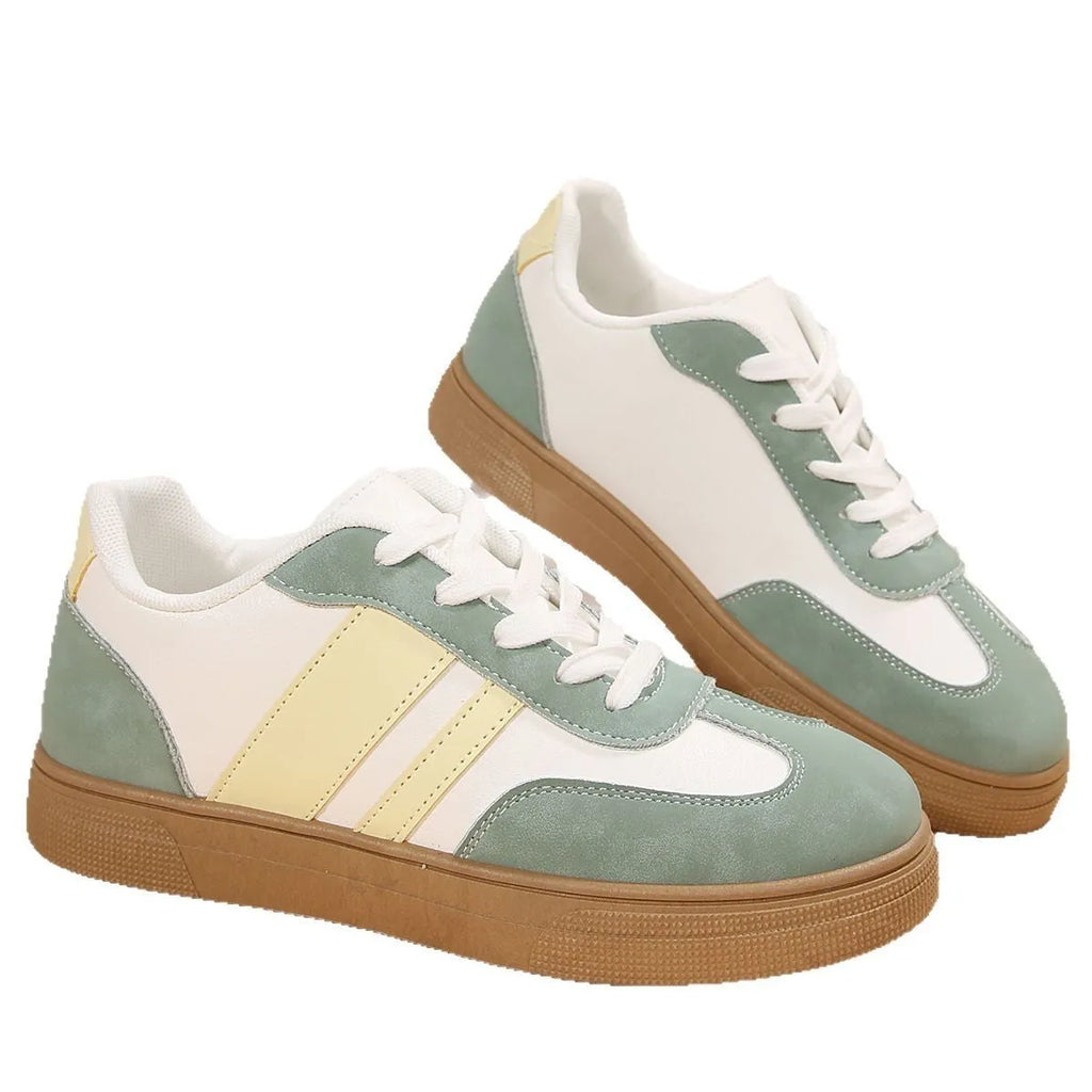 Women's green retro sports shoes with cross straps and leather stitching, low-top design with rubber sole