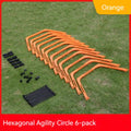Set of six foldable yellow green and orange hexagon football agility training rings on grass.